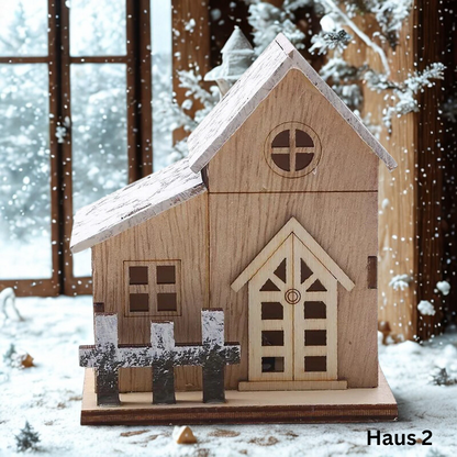 Dekoratives LED-Holzhaus mit warmweissem Licht und Schneedach