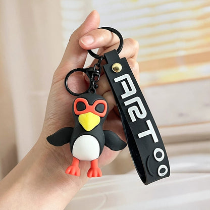 Brainrot Schlüsselanhänger Pinguin mit roter Brille und schwarzem Riemen