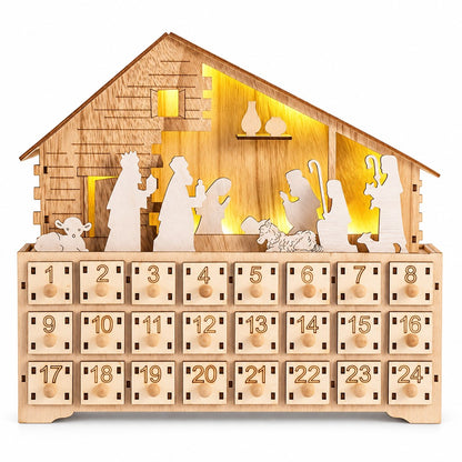 Adventskalender Krippe mit LED: Holzstall mit weissen Figuren vor warm leuchtender Rückwand, darunter 24 Schubladen