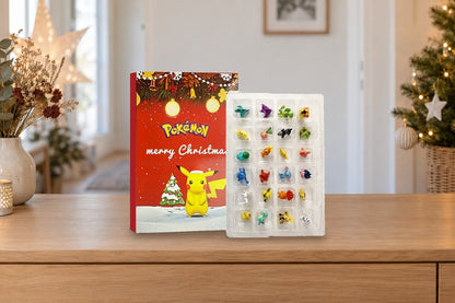 Roter Pokémon-Kalender mit Figuren-Einsatz auf der Flurkommode neben Trockenblumen